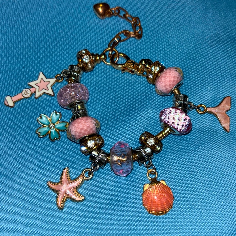 Gold charm bracelet with gold charms